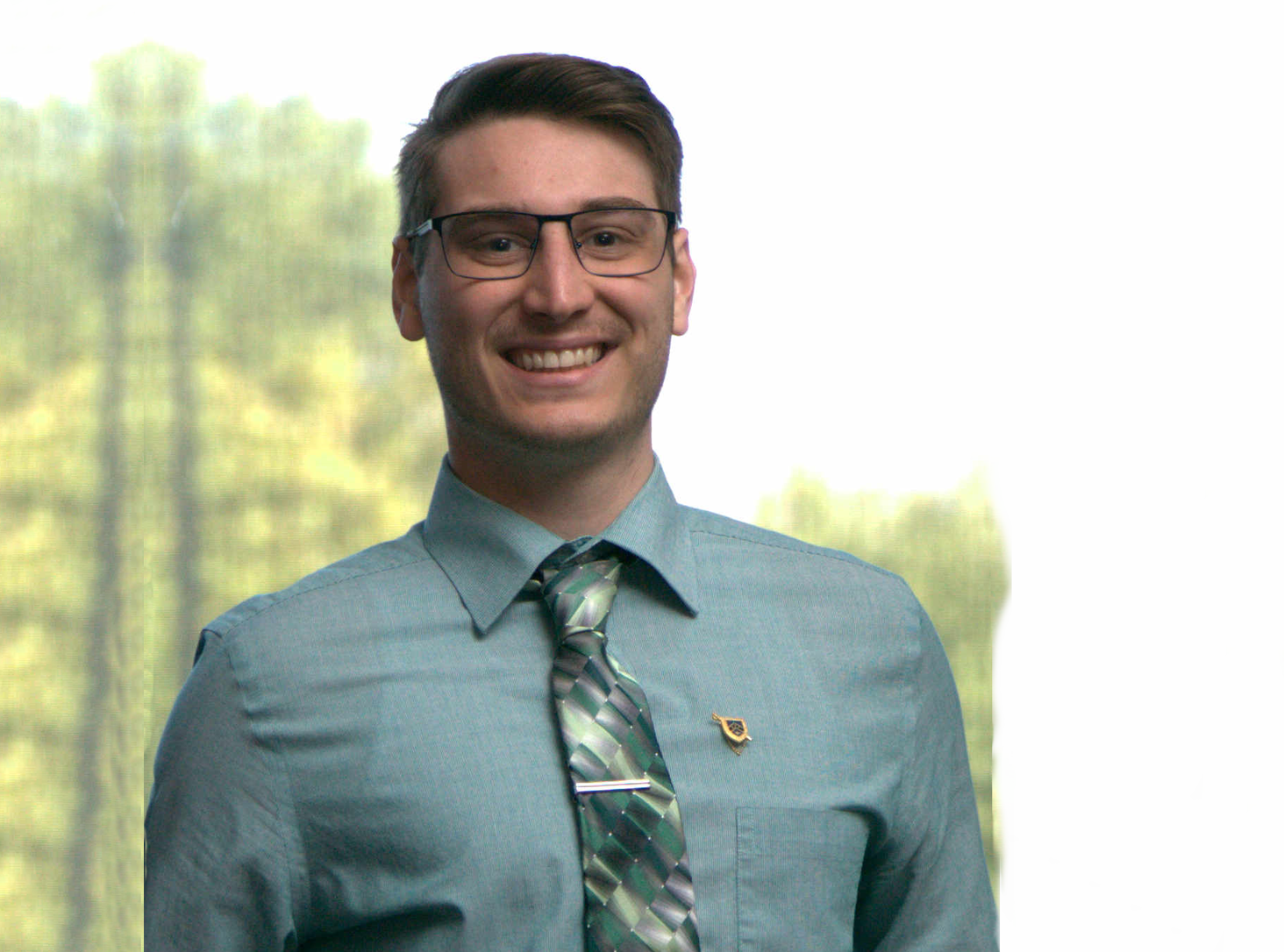 a picture of Nick Morrow smiling and looking professional